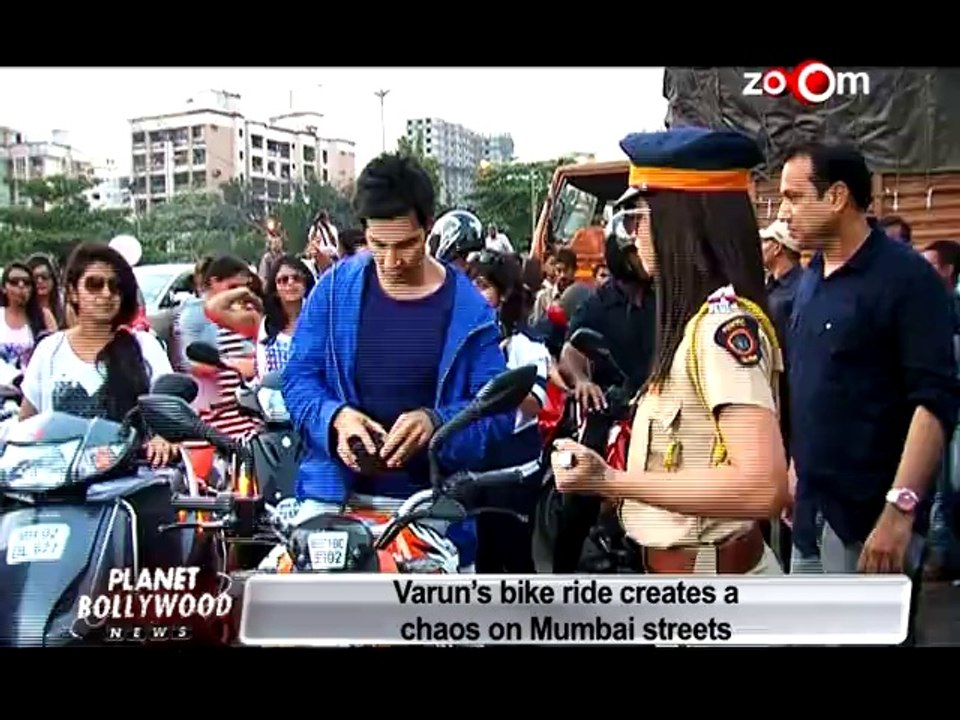 Captured Varun Dhawan riding bike on the streets of Mumbai