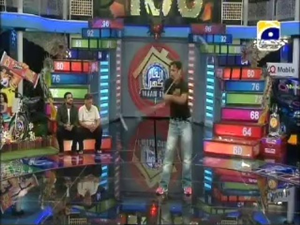 A man shows two tricks in Inam Ghar