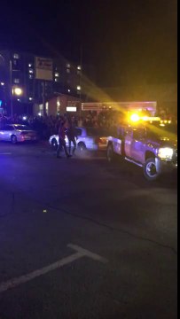 Rescue Workers Turn Cars Upright After Rowdy Student Party