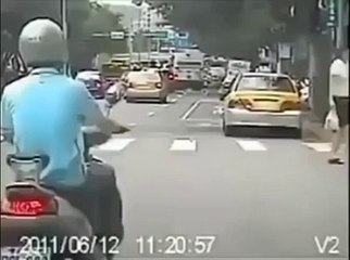 Scooter driver dragging a girl on the road... Crazy!