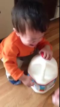 Baby Trains for Weightlifting Future With Giant Bottle of Milk