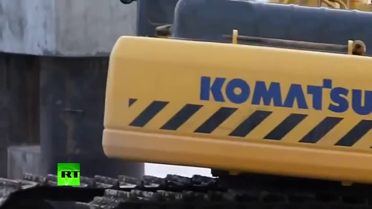 Crazy ferry video: Russians cross river in backhoes