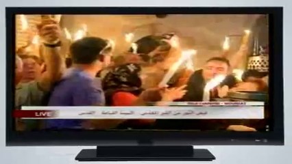 La Sainte Lumière sors de l'Eglise de la Résurrection à Jérusalem, 19/04/2014