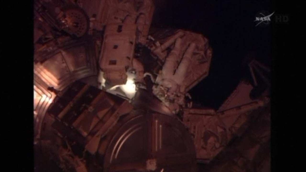 NASA astronauts perform spacewalk outside the International Space Station