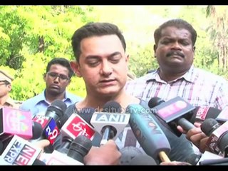 Bollywood actor Aamir Khan with wife Kiran Rao show their inked fingers after casting their vote