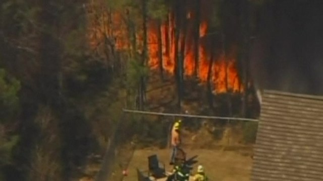 New Jersey forest fire threatens homes, forces school evacuation