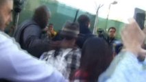 Justin Bieber fights off paps after held at LA airport
