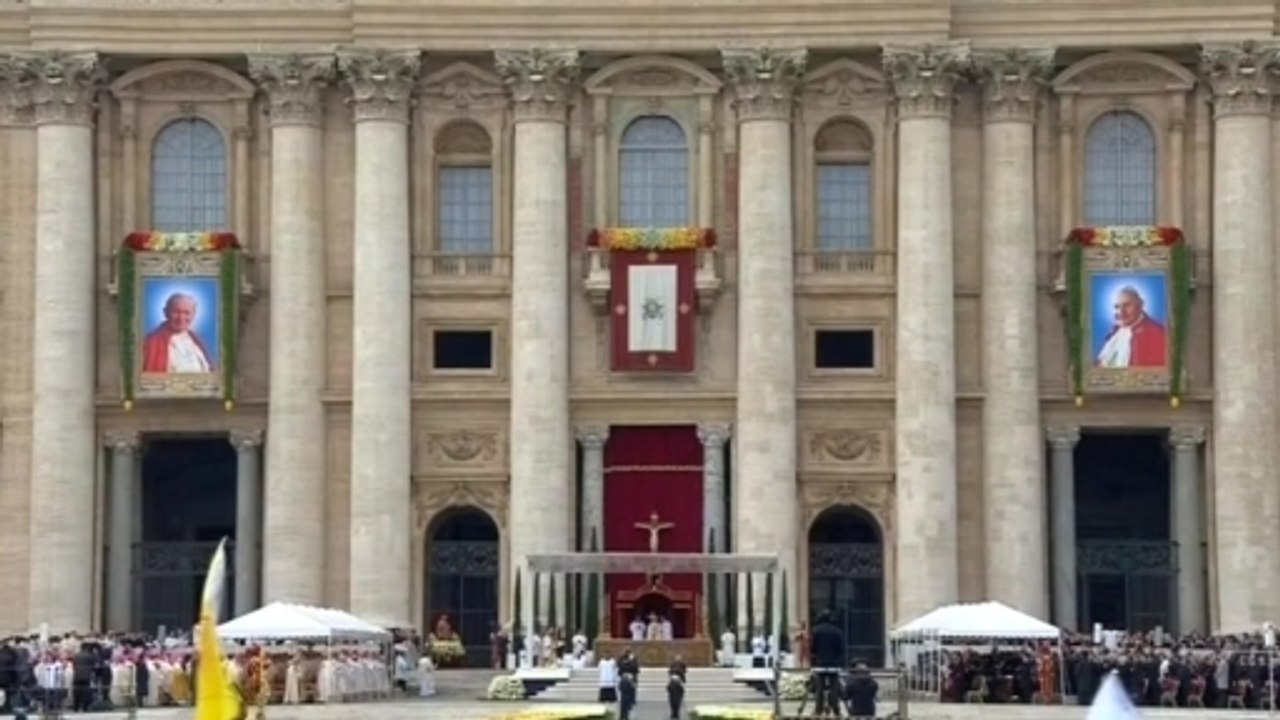 Thousands witness canonization of Popes John XXIII and John Paul II