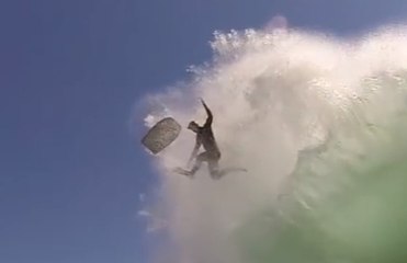 Insane Wipeout! Bodyboarder falls out of the sky and almost lands on dry sand.
