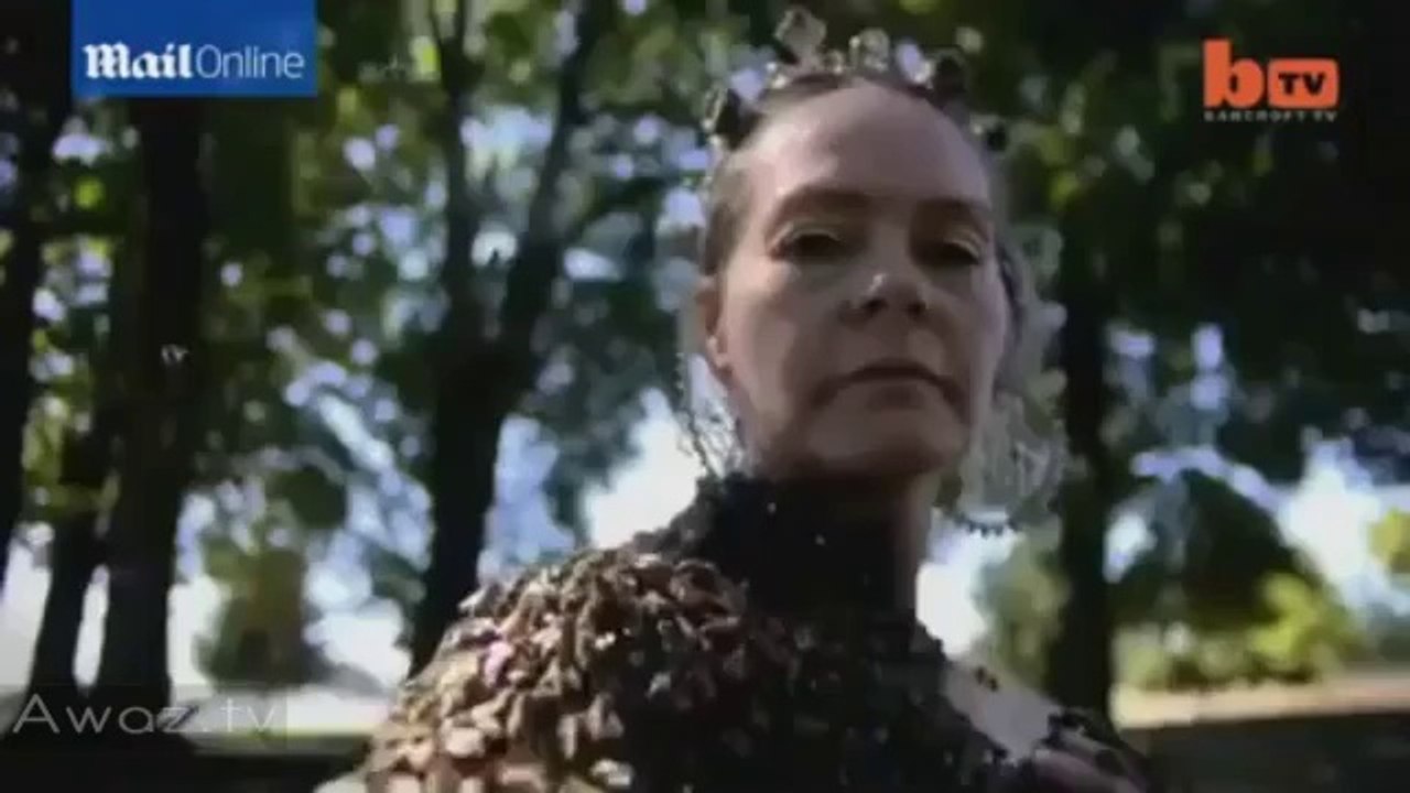 Woman WEARS 12,000 BEES on her naked chest