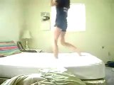 young girl trying gymnastic on bed and something happened bad to her.