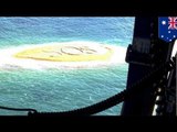 Stranded snorkelers rescued in Australia after writing huge SOS on sandbar