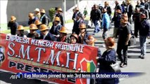 Bolivian leader raises minimum wage, leads May Day march