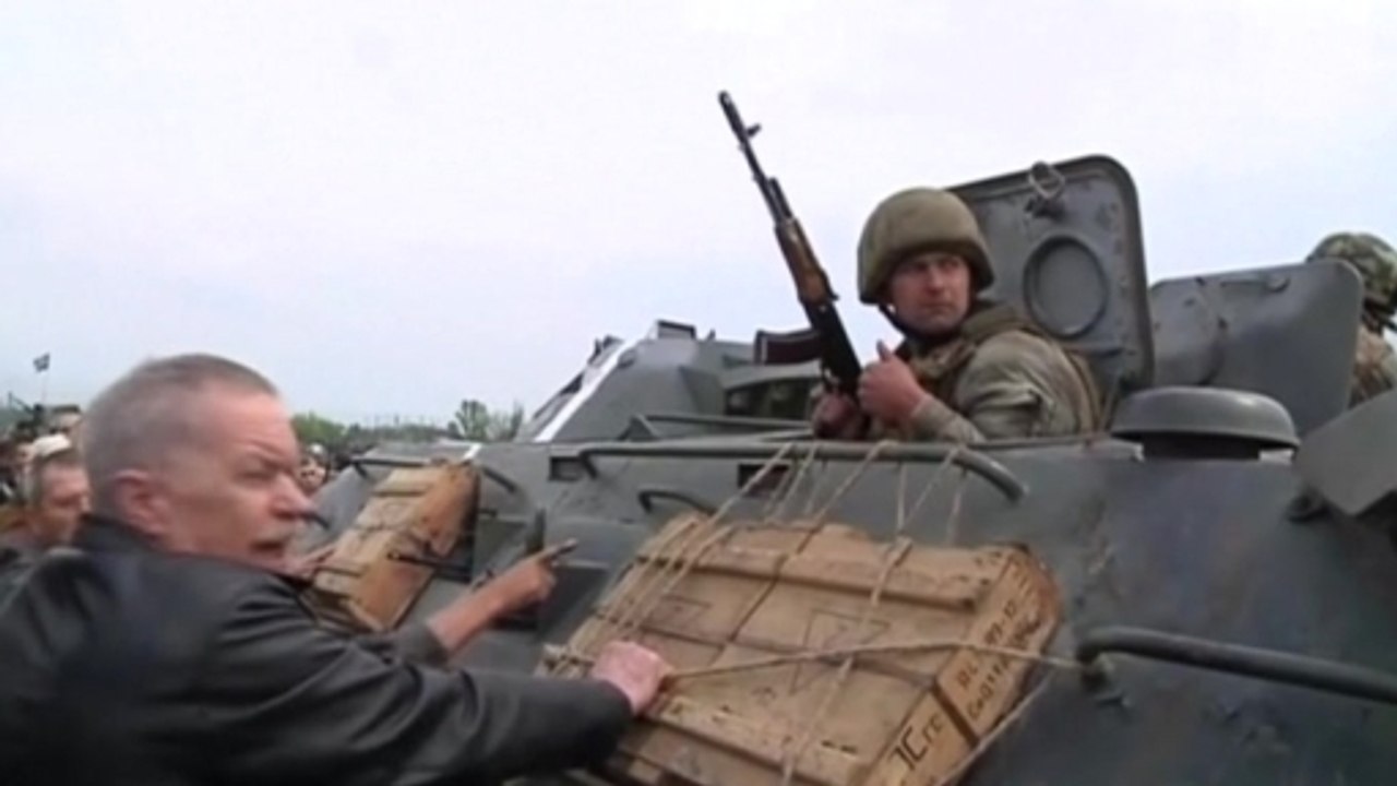 Angry residents in eastern Ukrainian village block government tanks