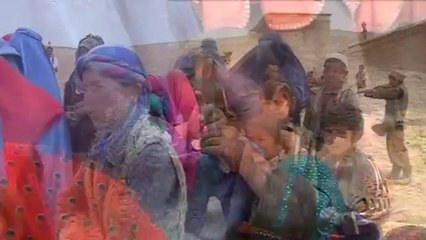 Survivors of deadly Afghan landside line up to receive aid