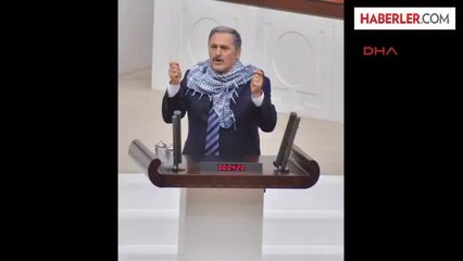 Çelebi Meclis Kürsüsüne Boynuna Poşu Takarak Çıktı