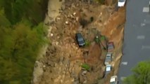 Sky view of a Massive sinkhole swallowing cars and train tracks in Baltimore