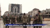 Syrian government forces celebrate in Homs