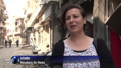 Civis retornam a bairro de Homs após dois anos
