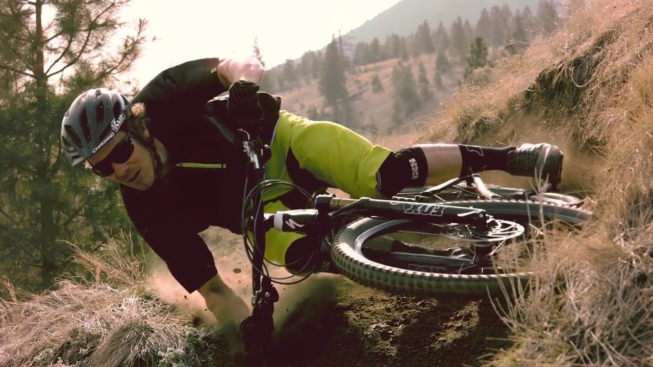 Mountain Biker Demonstrates Extreme Parallel To The Ground Turn