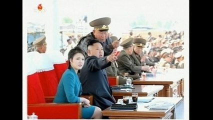 North Korean leader and his wife watch combat flight contest