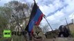Captured Kiev APC defends smouldering Mariupol city