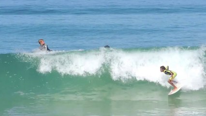 Lucas Bernard surfs in the sea.