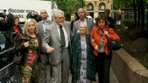 Rolf Harris walks into court with family