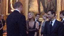 Prince William chats to Kate Moss at cancer charity dinner