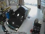 Woman Drives into a Garage Bay