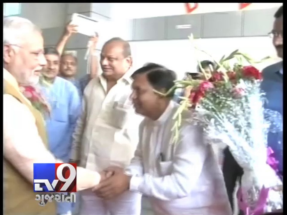 Modi at Ahmedabad airport, shaking hands to the...