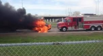 A burning school bus starts rolling and almost hits a fire truck