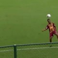 Ronaldinho juggling with a kid