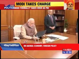 Narendra Modi formally takes charge