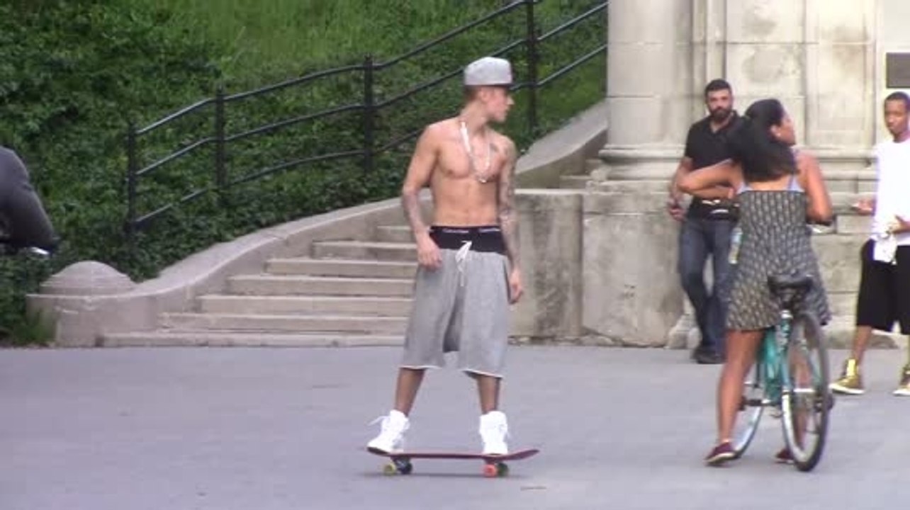 Justin Bieber Skateboards Around New York Shirtless