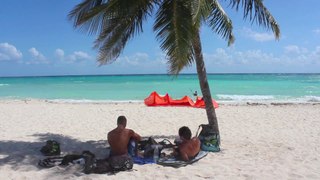 Kitesurfing in a caribbean virgin beach Riviera Maya