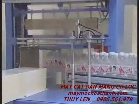 máy dán màng co lốc chai nước, máy bọc màng co lốc nước yến bán tự động