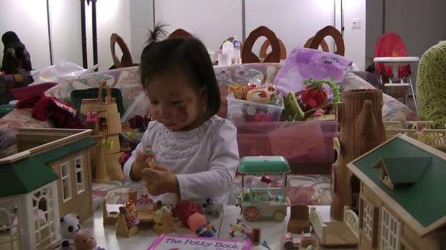 Girl Unwrapping Toy Gift