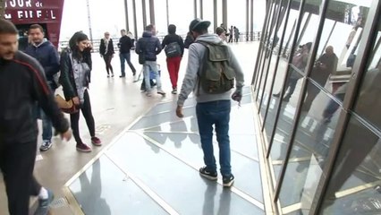 Daring tourists 'step into the void' at Eiffel Tower