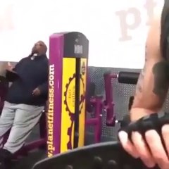 Guy Eating Pizza While Working Out