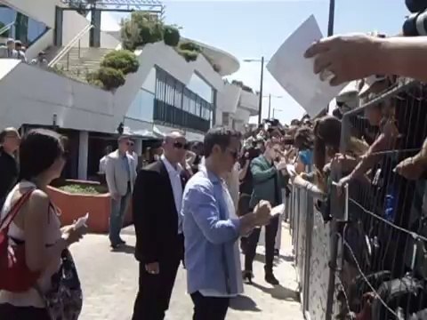 'The Rover' Photocall - Robert Pattinson and Guy pearce signing Autographs