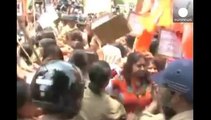 India: police clash with protesters rallying over violence against women