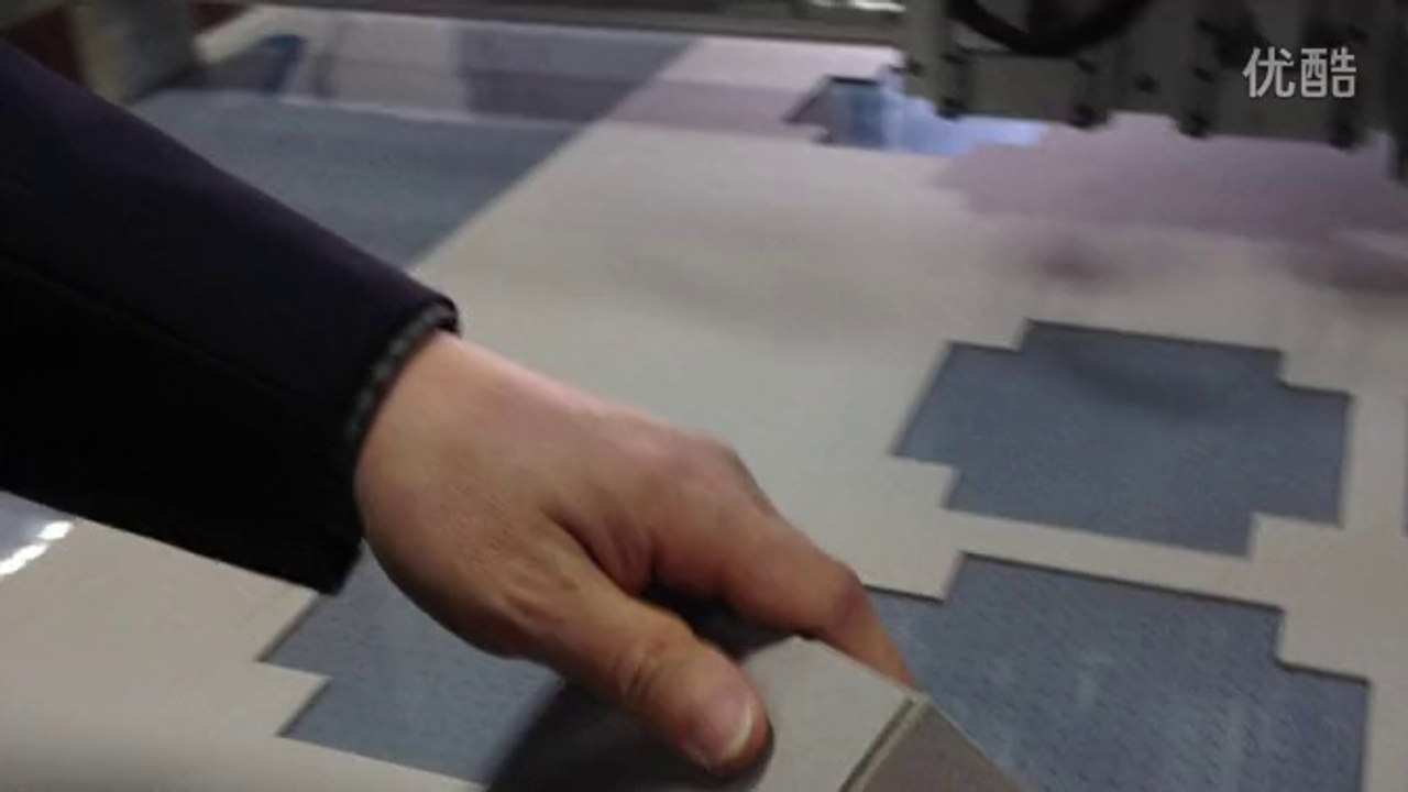 Person carries carton box sample maker digital cutting machine