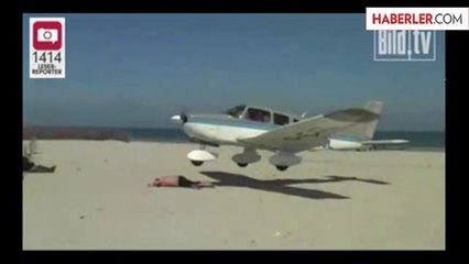 Uçak, Sahilde Güneşlenen Adamı Teğet Geçti