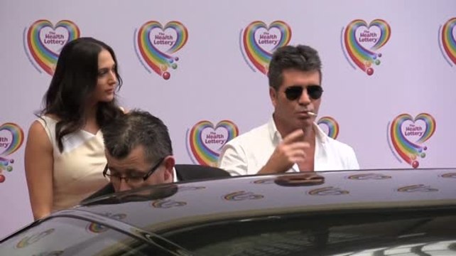Simon Cowell Arrives at the Health Lottery Tea Party Smoking a Cigarette