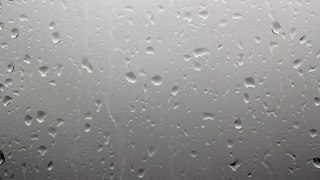 Raindrops on Window Dark Clouds Background - Free Stock Footage - OrangeHD.com