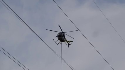 Un hélicoptère coupe des arbres trop proche de lignes électriques!