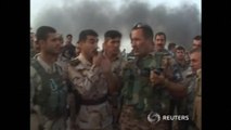 Iraqi security forces encounter burning debris on patrol, as ISIL increase Iraq gains
