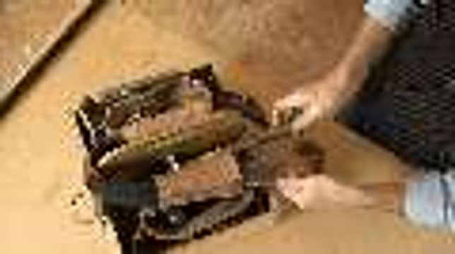 A tool-belt caddy keeps tools and fasteners from spilling onto the floor