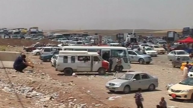 Mass exodus in northern Iraq as Sunni rebels surge towards Baghdad